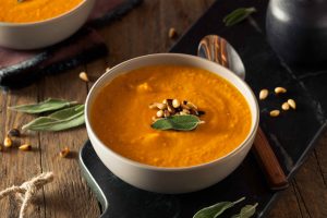 Homemade Carrot Ginger Soup with Toasted Pine Nuts
