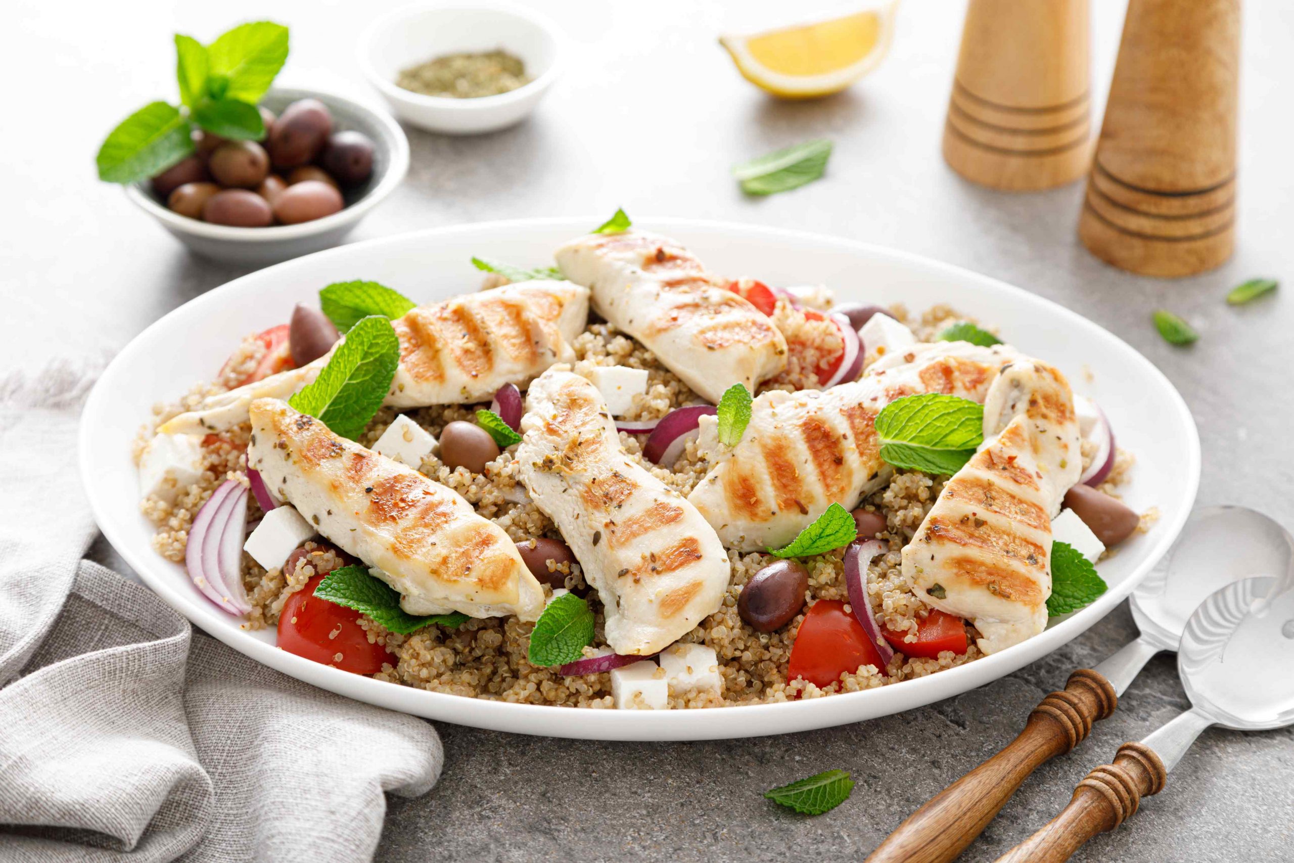 Grilled chicken breast and greek salad with quinoa