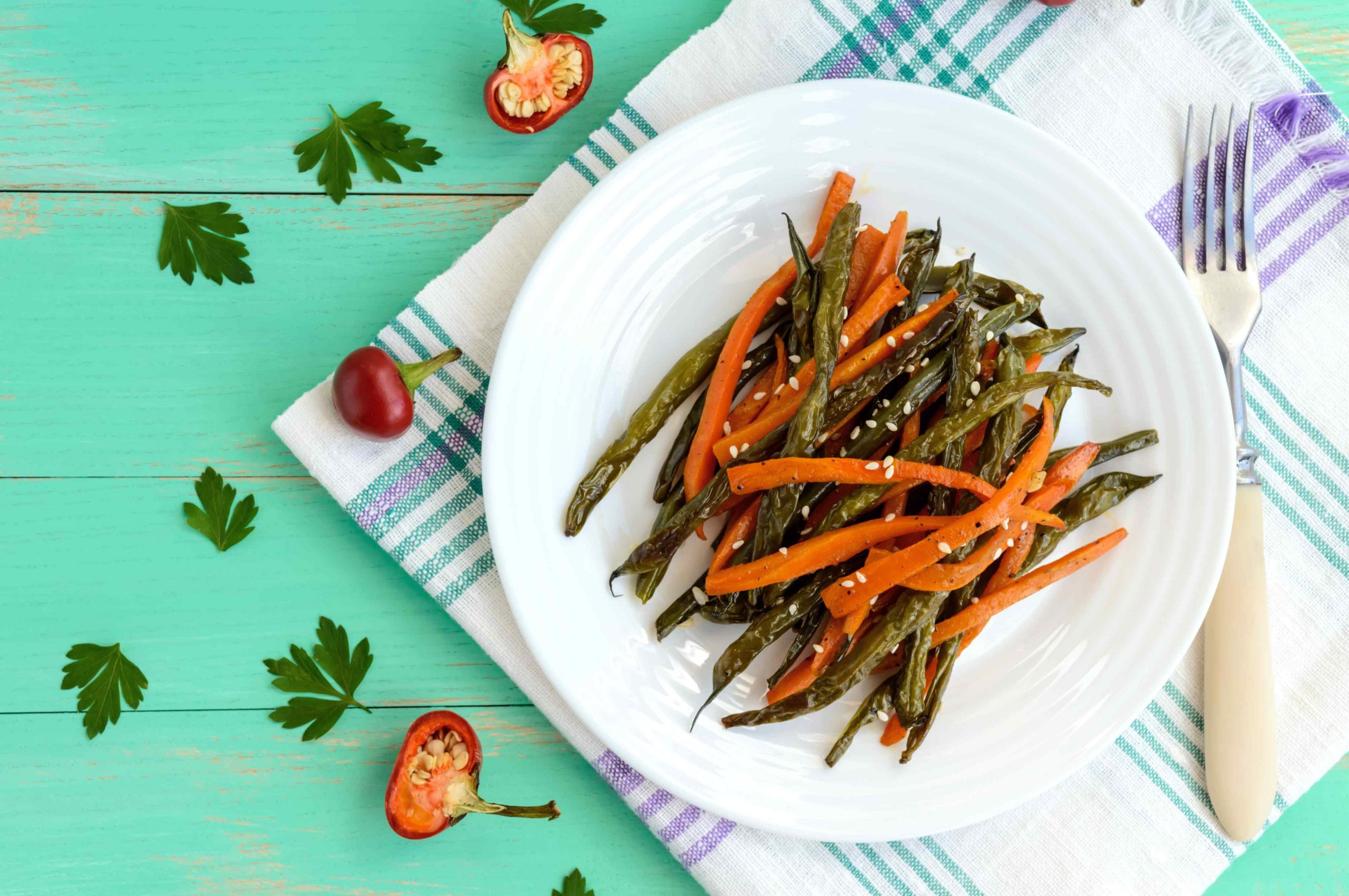 Baked green beans and carrots - vegan diets. The top view